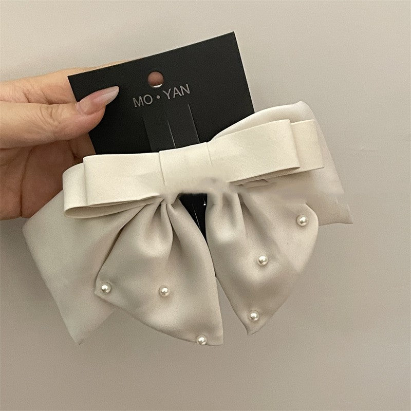 Pince à cheveux nœud Satin Elegance : accessoire élégant pour femme